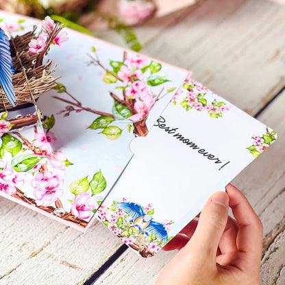 Mother Bird Pop Up Card – 3D Bluebird Nest with Baby Birds and Pink Blossoms – Heartwarming Mother’s Day, Birthday, Thank You Greeting Card for Mom, Grandma, Wife, Her, Nature Lovers